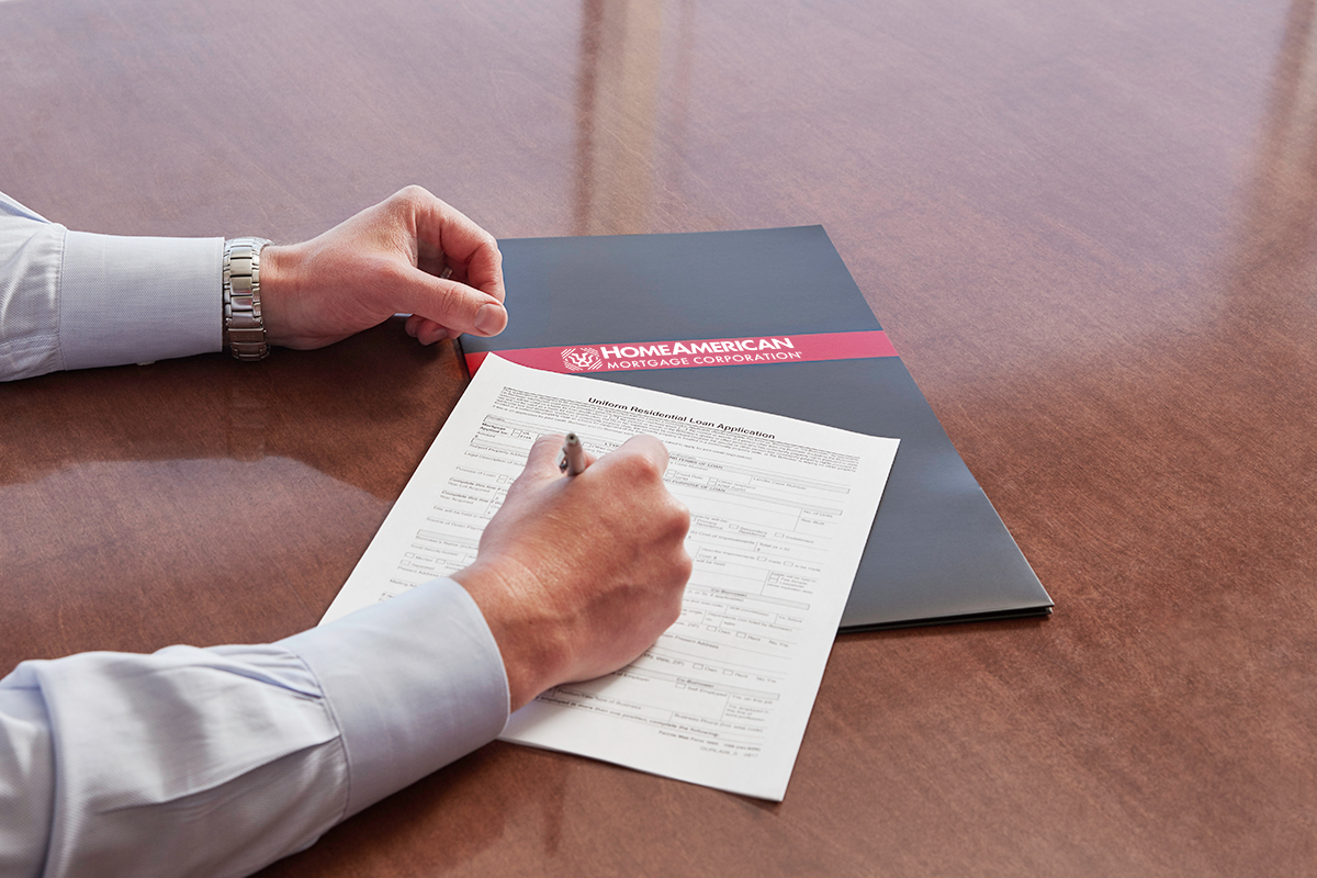 Man signing Mortgage documents