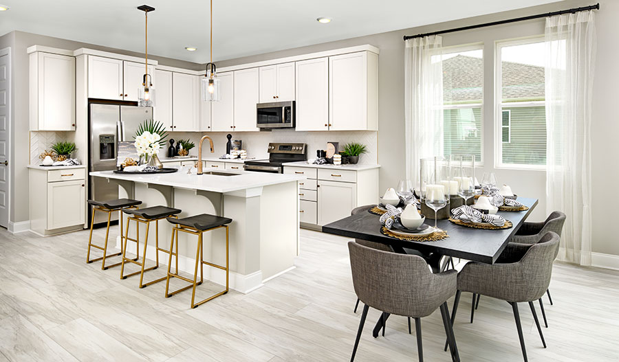 Inviting Moonstone plan kitchen with a center island and an adjacent dining area